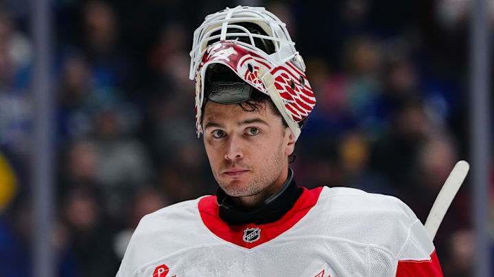 Alex Lyon taking a break between plays during the Detroit Red Wings' contest against the Vancouver Canucks.