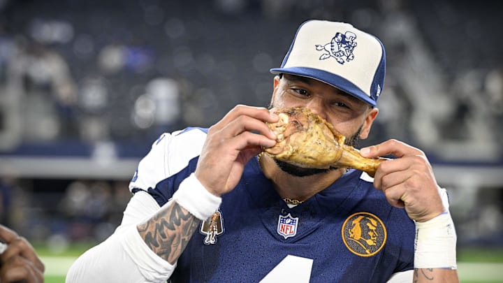 Dallas Cowboys Dak Prescott eats a turkey leg after the Thanksgiving victory over the Washington Commanders
