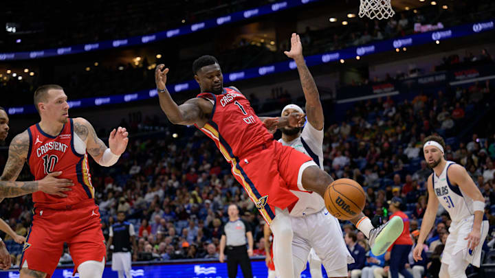 Jan 29, 2025; New Orleans, Louisiana, USA; New Orleans Pelicans forward Zion Williamson (1) loses control of the ball next Dallas Mavericks center Daniel Gafford during the second half at Smoothie King Center. Mandatory Credit: Matthew Hinton-Imagn Images