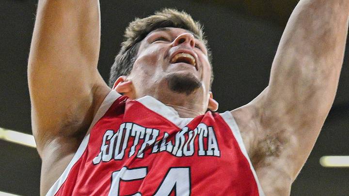 Nov 12, 2024; Iowa City, Iowa, USA; South Dakota Coyotes center Cameron Fens (54) shoots against Iowa Hawkeyes forward Even Brauns (0) during the first half at Carver-Hawkeye Arena. Mandatory Credit: Jeffrey Becker-Imagn Images Nov 12, 2024; Iowa City, Iowa, USA; South Dakota Coyotes center Cameron Fens (54) shoots against Iowa Hawkeyes forward Even Brauns (0) during the first half at Carver-Hawkeye Arena. Mandatory Credit: Jeffrey Becker-Imagn Images