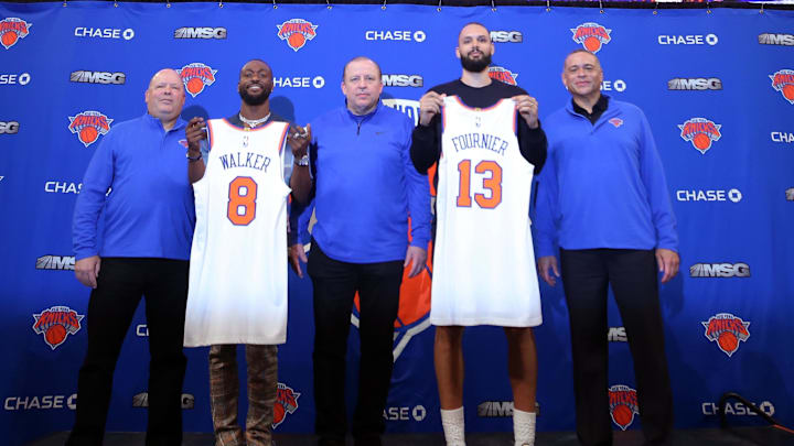 Aug 17, 2021; New York, New York, USA; New York Knicks guard Kemba Walker (8) and guard Evan Fournier (13) pose for a photo with team president Leon Rose (left) and head coach Tom Thibodeau (middle) and general manager Scott Perry (right) during their introductory press conference at Madison Square Garden. Mandatory Credit: Brad Penner-Imagn Images