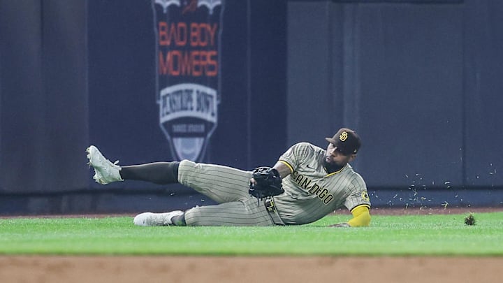 Bronx, New York, USA; San Diego Padres left fielder Jason Heyward (22) makes a diving catch in the third inning against the New York Yankees at Yankee Stadium. Bronx, New York, USA; San Diego Padres left fielder Jason Heyward (22) makes a diving catch in the third inning against the New York Yankees at Yankee Stadium.