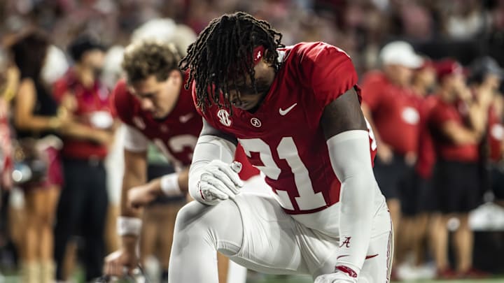 Alabama defensive back Dre Kirkpatrick Jr. takes a knee before the 2025 Third Saturday in October rivalry game. 
