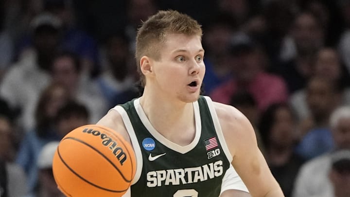 March 23, 2024, Charlotte, NC, USA; Michigan State Spartans forward Jaxon Kohler (0) passes the ball against the North Carolina Tar Heels in the second round of the 2024 NCAA Tournament at the Spectrum Center. Mandatory Credit: Bob Donnan-Imagn Images