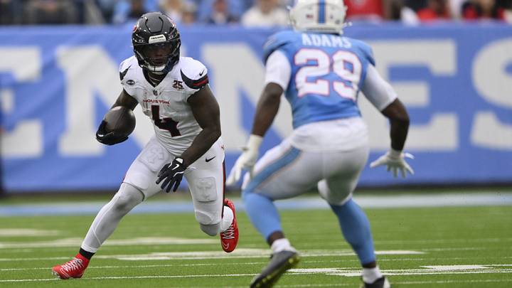 Oct 11, 2026; Nashville, Tennessee, USA; Houston Texans running back Woody Marks (4) runs the ball against Tennessee Titans safety Tony Adams (29) during the second quarter at Nissan Stadium. Mandatory Credit: Steve Roberts-Imagn Images Oct 11, 2026; Nashville, Tennessee, USA; Houston Texans running back Woody Marks (4) runs the ball against Tennessee Titans safety Tony Adams (29) during the second quarter at Nissan Stadium. Mandatory Credit: Steve Roberts-Imagn Images