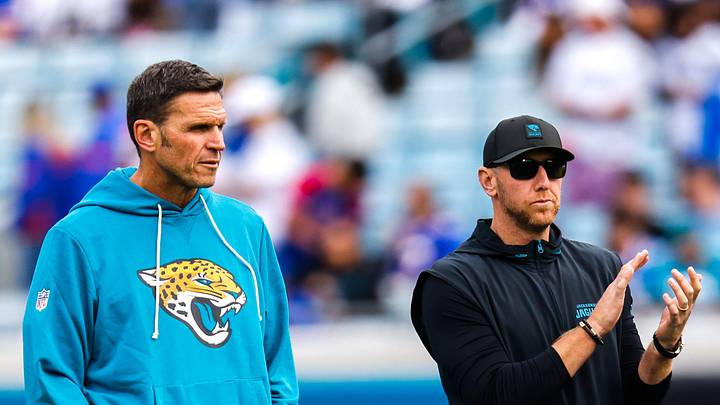Jacksonville Jaguars Executive Vice President of Football Operations Tony Boselli, left and Jacksonville Jaguars head coach Liam Coen watch warm up before an NFL football AFC Wild Card playoff matchup, Sunday, Jan. 11, 2026, in Jacksonville, Fla. Bills lead 10-7 at the half over the Jaguars. [Doug Engle/Florida Times-Union]