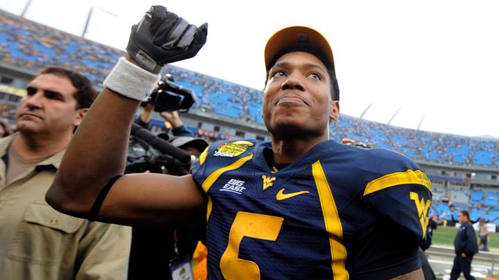 Dec. 27, 2008; Charlotte, NC, USA; West Virginia Mountaneers quarterback Pat White (5) reacts after the Mountaineers 31-30 victory against the North Carolina Tar Heels at Bank of America Stadium. Mandatory Credit: Bob Donnan-USA TODAY Sports Dec. 27, 2008; Charlotte, NC, USA; West Virginia Mountaneers quarterback Pat White (5) reacts after the Mountaineers 31-30 victory against the North Carolina Tar Heels at Bank of America Stadium. Mandatory Credit: Bob Donnan-USA TODAY Sports