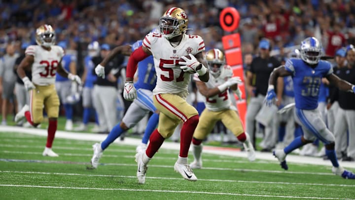 San Francisco 49ers linebacker Dre Greenlaw returns an interception back for a touchdown against the Detroit Lions on Sunday, Sept. 12, 2021 at Ford Field.