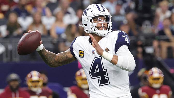 Dallas Cowboys quarterback Dak Prescott (4) drops back to pass against the Washington Commanders during the first quarter at AT&T Stadium. Dallas Cowboys quarterback Dak Prescott (4) drops back to pass against the Washington Commanders during the first quarter at AT&T Stadium.