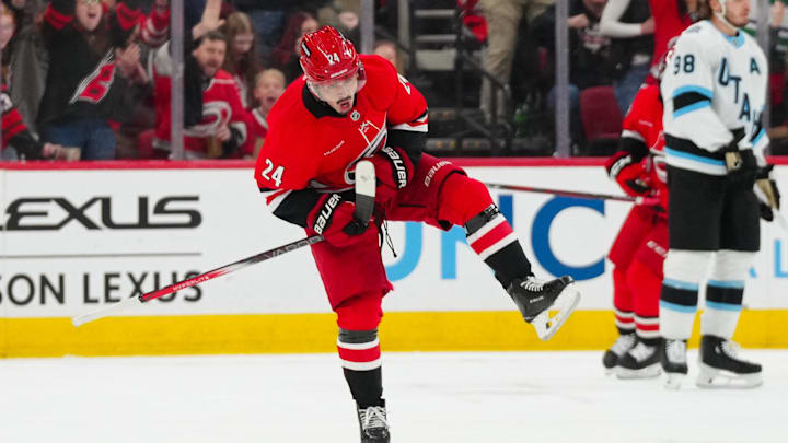 Feb 8, 2025; Raleigh, North Carolina, USA;  Carolina Hurricanes center Seth Jarvis (24) celebrates his goal against the Utah Hockey Club during the second period at Lenovo Center. Mandatory Credit: James Guillory-Imagn Images