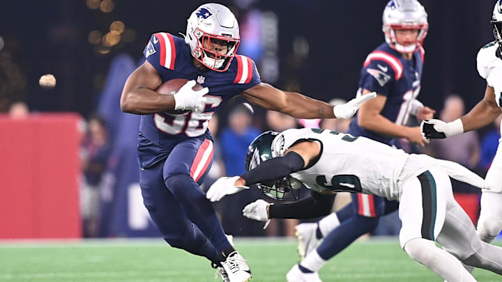 Aug 15, 2024; Foxborough, MA, USA; New England Patriots running back Kevin Harris (36) avoids a tackle by Philadelphia Eagles safety Tristin McCollum (36) during the first half at Gillette Stadium. Mandatory Credit: Eric Canha-USA TODAY Sports