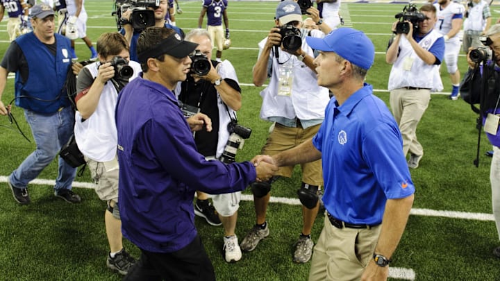 Aug 31, 2013; Seattle, WA, USA; Washington Huskies head coach Steve Sarkisian (left) and Boise State Broncos head coach Chris Peterson (right) shake hands after the game between the Washington Huskies and the Boise State Broncos at Husky Stadium. Washington defeated Boise State 38-6. Mandatory Credit: Steven Bisig-Imagn Images