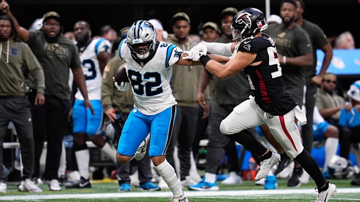 Carolina Panthers tight end Tommy Tremble (82) runs with the ball in the overtime against