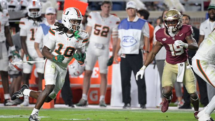 Oct 4, 2025; Tallahassee, Florida, USA; Miami Hurricanes wide receiver Malachi Toney (10) runs against Florida State Seminoles defensive back Jerry Wilson (19) during the first half at Doak S. Campbell Stadium. Mandatory Credit: Melina Myers-Imagn Images