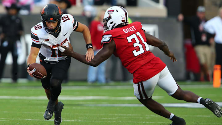 Oct 25, 2025; Lubbock, Texas, USA; Texas Tech Red Raiders defensive end David Bailey (31) pressures Oklahoma State Cowboys quarterback Noah Walters (12) in the second half at Jones AT&T Stadium. Mandatory Credit: Michael C. Johnson-Imagn Images Oct 25, 2025; Lubbock, Texas, USA; Texas Tech Red Raiders defensive end David Bailey (31) pressures Oklahoma State Cowboys quarterback Noah Walters (12) in the second half at Jones AT&T Stadium. Mandatory Credit: Michael C. Johnson-Imagn Images