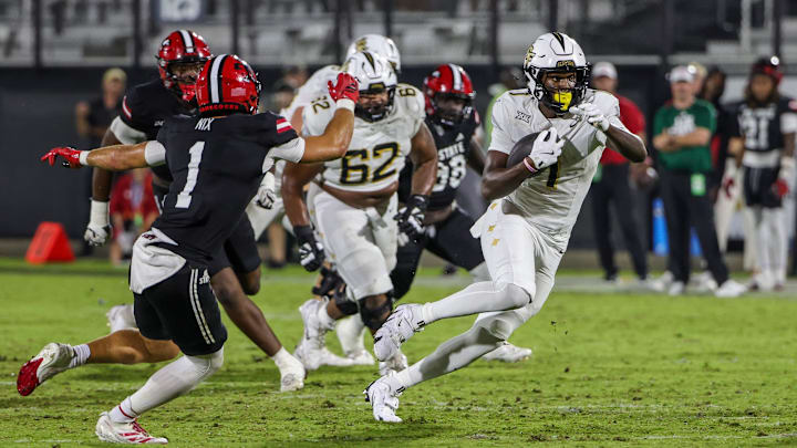 Aug 28, 2025; Orlando, Florida, USA; UCF Knights tight end Kylan Fox (1) carries the ball during the second quarter against the Jacksonville State Gamecocks at Acrisure Bounce House. Mandatory Credit: Mike Watters-Imagn Images
