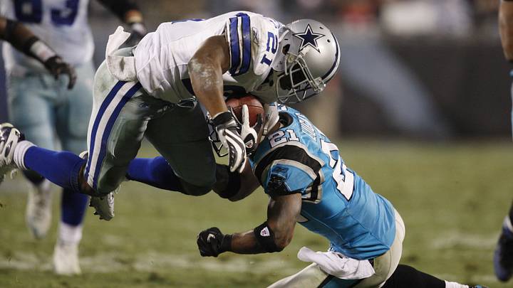 Dec 22, 2007, Charlotte, NC, USA; Dallas Cowboys running back Julius Jones (21) is tackled by Carolina Panthers cornerback Ken Lucas (21) in the Cowboys 20-13 victory against the Panthers at Bank of America Stadium. Mandatory Credit: Bob Donnan-Imagn Images