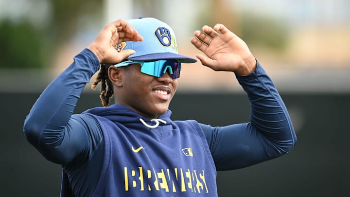 Milwaukee Brewers infielder Jesús Made (86) stretches during spring training workouts Monday, February 16, 2026, at American Family Fields of Phoenix in Phoenix, Arizona.
