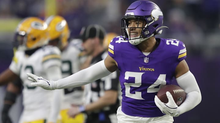 Dec 29, 2024; Minneapolis, Minnesota, USA; Minnesota Vikings safety Camryn Bynum (24) celebrates recovering a fumble by Green Bay Packers running back Josh Jacobs (8) in the first quarter at U.S. Bank Stadium. Mandatory Credit: Dan Powers/USA TODAY NETWORK-Wisconsin via Imagn Images