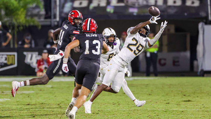 Aug 28, 2025; Orlando, Florida, USA; UCF Knights defensive back Jayden Bellamy (29) intercepts a pass during the second half against the Jacksonville State Gamecocks at Acrisure Bounce House. Mandatory Credit: Mike Watters-Imagn Images Aug 28, 2025; Orlando, Florida, USA; UCF Knights defensive back Jayden Bellamy (29) intercepts a pass during the second half against the Jacksonville State Gamecocks at Acrisure Bounce House. Mandatory Credit: Mike Watters-Imagn Images