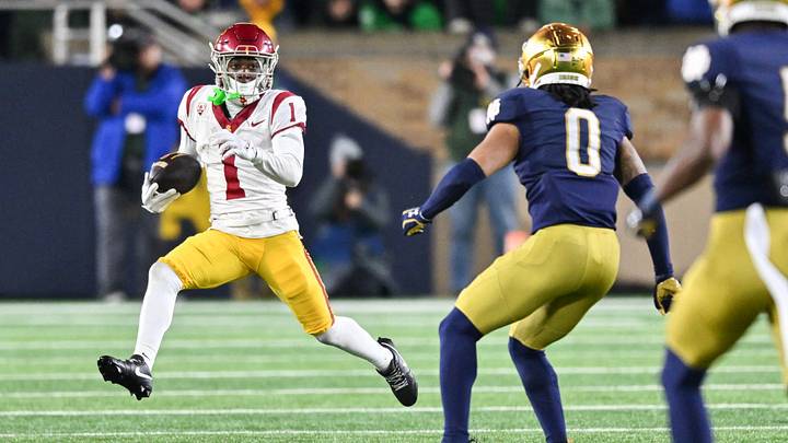 Oct 14, 2023; South Bend, Indiana, USA; USC Trojans wide receiver Zachariah Branch (1) runs the ball as Notre Dame Fighting Irish safety Xavier Watts (0) defends in the third quarter at Notre Dame Stadium. Mandatory Credit: Matt Cashore-USA TODAY Sports Oct 14, 2023; South Bend, Indiana, USA; USC Trojans wide receiver Zachariah Branch (1) runs the ball as Notre Dame Fighting Irish safety Xavier Watts (0) defends in the third quarter at Notre Dame Stadium. Mandatory Credit: Matt Cashore-USA TODAY Sports