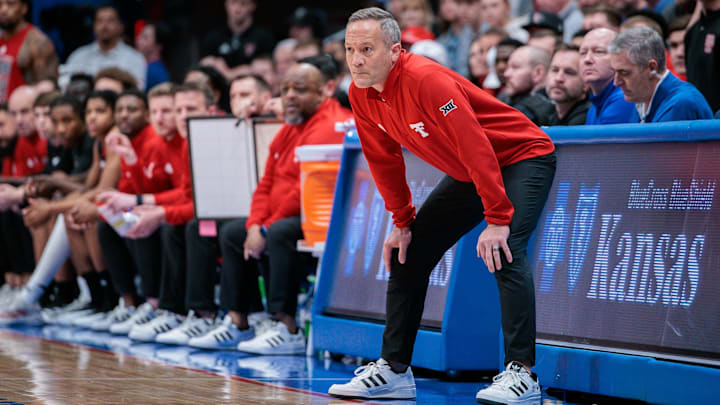Mar 1, 2025; Lawrence, Kansas, USA; Texas Tech Red Raiders coach Grant McCasland watches game play during the first half against the Kansas Jayhawks at Allen Fieldhouse. Mandatory Credit: William Purnell-Imagn Images