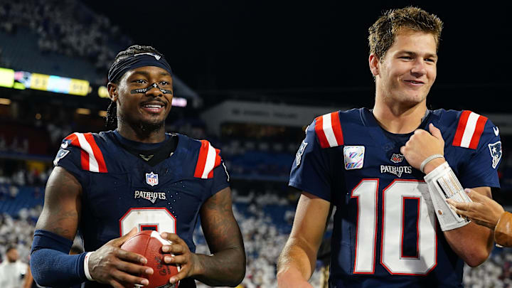 New England Patriots quarterback Drake Maye (10) and wide receiver Stefon Diggs (8) walk off the field against the Buffalo Bills after the game at Highmark Stadium.
