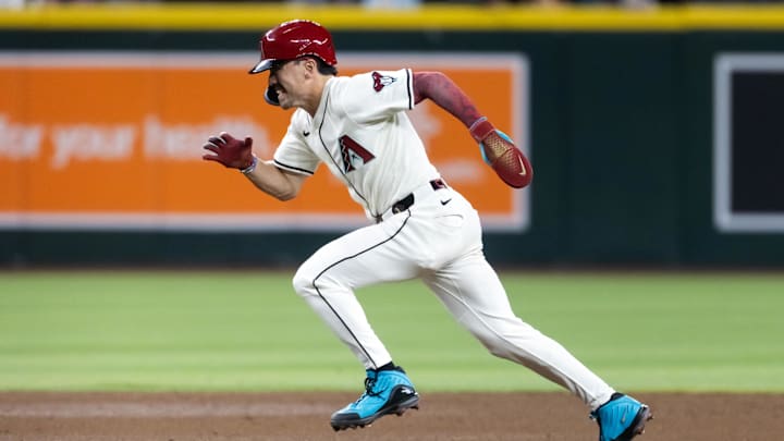 Apr 22, 2025; Phoenix, Arizona, USA; Arizona Diamondbacks base runner Corbin Carroll scores in the eighth inning against the Tampa Bay Rays at Chase Field. Mandatory Credit: Mark J. Rebilas-Imagn Images