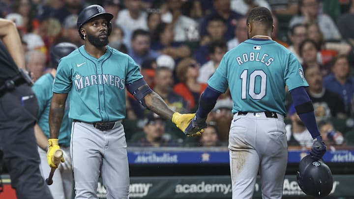 Seattle Mariners right fielder Victor Robles (10) celebrates with left fielder Randy Arozarena after scoring against the Houston Astros on Sept. 23 at Minute Maid Park. Seattle Mariners right fielder Victor Robles (10) celebrates with left fielder Randy Arozarena after scoring against the Houston Astros on Sept. 23 at Minute Maid Park.