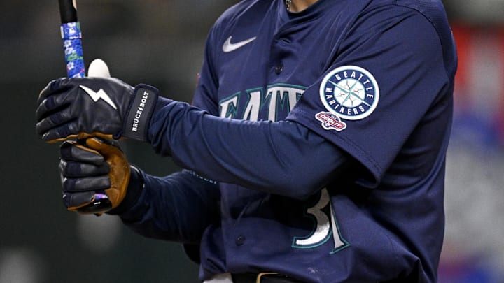 May 2, 2025; Arlington, Texas, USA; A view of the Seattle Mariners logo and MLB Debut logo on the jersey of right fielder Rhylan Thomas (31) during the second inning against the Texas Rangers at Globe Life Field. Mandatory Credit: Jerome Miron-Imagn Images May 2, 2025; Arlington, Texas, USA; A view of the Seattle Mariners logo and MLB Debut logo on the jersey of right fielder Rhylan Thomas (31) during the second inning against the Texas Rangers at Globe Life Field. Mandatory Credit: Jerome Miron-Imagn Images