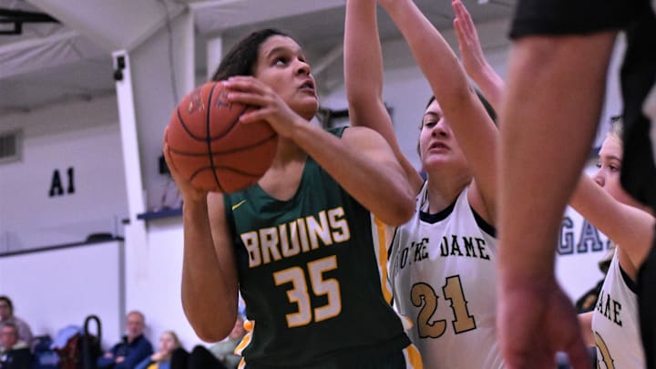 Rock Bridge's Jayda Porter (35) battles the Quincy Notre Dame defense during the Sophie Cunningham Classic on Dec. 4, 2022, at Columbia, Mo.