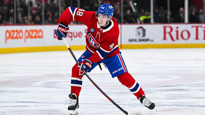 Dec 7, 2024; Montreal, Quebec, CAN; Montreal Canadiens defenseman Lane Hutson (48) plays the puck against the Washington Capitals during the second period at Bell Centre. Mandatory Credit: David Kirouac-Imagn Images