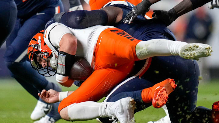 Cincinnati Bengals quarterback Jake Browning (6) is sacked by Denver Broncos defensive end John Franklin-Myers (98) in the fourth quarter of the NFL Week 4 Monday Night Football game between the Denver Broncos and the Cincinnati Bengals at Empower Field at Mile High in Denver on Monday, Sept. 29, 2025. The Bengals fell to 2-2 with a 28-3 loss to the Broncos. Cincinnati Bengals quarterback Jake Browning (6) is sacked by Denver Broncos defensive end John Franklin-Myers (98) in the fourth quarter of the NFL Week 4 Monday Night Football game between the Denver Broncos and the Cincinnati Bengals at Empower Field at Mile High in Denver on Monday, Sept. 29, 2025. The Bengals fell to 2-2 with a 28-3 loss to the Broncos.