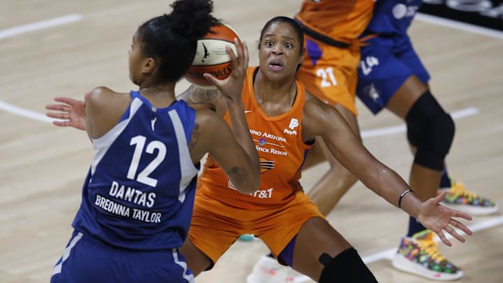 Sep 17, 2020; Palmetto, Florida, USA; Phoenix Mercury center Kia Vaughn (1) guards Minnesota Lynx forward Damiris Dantas (12) during the second half at the FELD entertainment complex. Mandatory Credit: Reinhold Matay-Imagn Images
