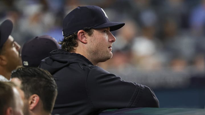 Jun 5, 2024; Bronx, New York, USA; New York Yankees pitcher Gerrit Cole (45) looks on from the dug out during the eighth inning against the Minnesota Twins at Yankee Stadium. Mandatory Credit: Vincent Carchietta-USA TODAY Sports