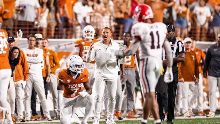 Oct 19, 2024; Austin, Texas, USA; Texas Longhorns head coach Steve Sarkisian and corner back Jahdae Barron (7) react after a pass interference call in the third quarter against the Georgia Bulldogs at Darrell K Royal-Texas Memorial Stadium. Mandatory Credit: Brett Patzke-Imagn Images