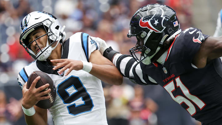 Aug 16, 2025; Houston, Texas, USA; Carolina Panthers quarterback Bryce Young (9) is tackled for a loss by Houston Texans defensive end Will Anderson Jr. (51) in the first quarter at NRG Stadium. Mandatory Credit: Thomas Shea-Imagn Images