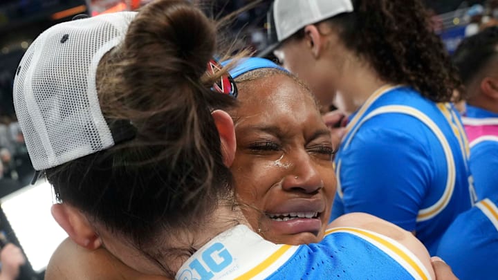 UCLA Bruins forward Janiah Barker (0) hugs Angela Dugalic (32) after their team defeats the USC Trojans during the 2025 TIAA Big Ten Women's Basketball Tournament final on Sunday, March 9, 2025, at Gainbridge Fieldhouse in Indianapolis. UCLA defeated USC 72-67.
