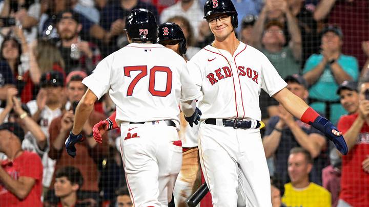 Jun 12, 2024; Boston, Massachusetts, USA; Boston Red Sox shortstop David Hamilton (70) high-fives first base Bobby Dalbec (29) after hitting a two-run home run against the Philadelphia Phillies during the sixth inning at Fenway Park. Mandatory Credit: Brian Fluharty-Imagn Images