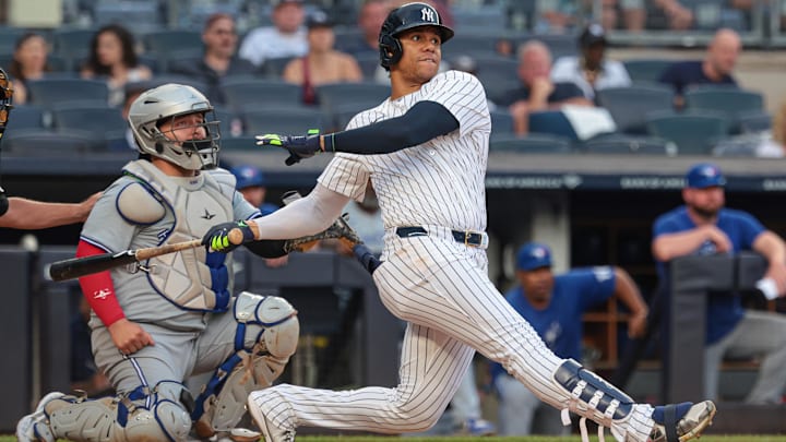 Aug 4, 2024; Bronx, New York, USA; New York Yankees right fielder Juan Soto (22) double during the eighth inning against the Toronto Blue Jays at Yankee Stadium. Mandatory Credit: Vincent Carchietta-Imagn Images