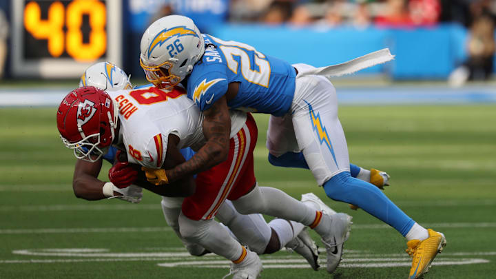 Jan 7, 2024; Inglewood, California, USA; Kansas City Chiefs wide receiver Justyn Ross (8) is tackled by Los Angeles Chargers cornerback Asante Samuel Jr. (26) during the first quarter at SoFi Stadium. Mandatory Credit: Kiyoshi Mio-Imagn Images
