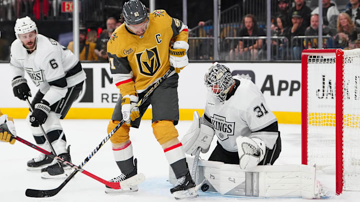 Oct 8, 2025; Las Vegas, Nevada, USA; Vegas Golden Knights right wing Mark Stone (61) deflects the puck against Los Angeles Kings goaltender Anton Forsberg (31) during the second period at T-Mobile Arena. Mandatory Credit: Stephen R. Sylvanie-Imagn Images