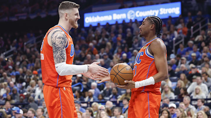 Dec 3, 2024; Oklahoma City, Oklahoma, USA; Oklahoma City Thunder center Isaiah Hartenstein (55) and guard Aaron Wiggins (21) celebrate after a play against the Utah Jazz during the second quarter of an NBA Cup game at Paycom Center. Mandatory Credit: Alonzo Adams-Imagn Images