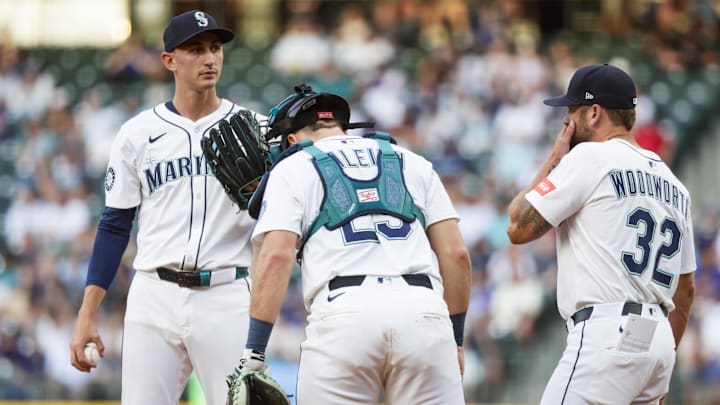 Seattle Mariners pitcher George Kirby (left) is visited on the mound during a game against the Milwaukee Brewers on July 21 at T-Mobile Park.