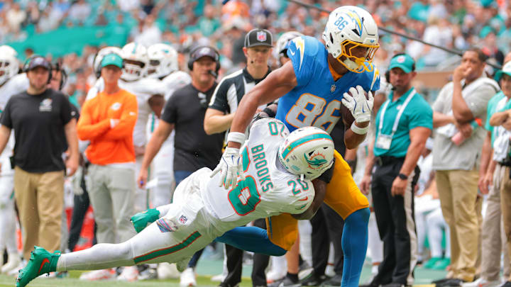 Los Angeles Chargers tight end Oronde Gadsden II (86) carries the football against Miami Dolphins linebacker Jordyn Brooks (20) during the third quarter at Hard Rock Stadium in Week 6. Los Angeles Chargers tight end Oronde Gadsden II (86) carries the football against Miami Dolphins linebacker Jordyn Brooks (20) during the third quarter at Hard Rock Stadium in Week 6.