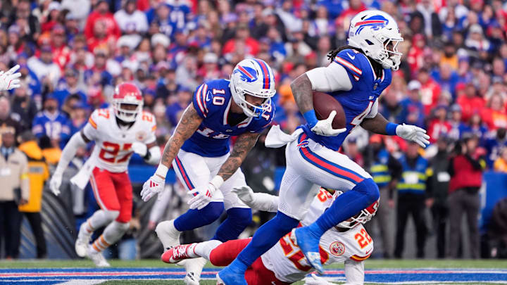 Nov 2, 2025; Orchard Park, New York, USA; Buffalo Bills running back James Cook III (4) runs the ball in the first quarter against the Kansas City Chiefs at Highmark Stadium. Nov 2, 2025; Orchard Park, New York, USA; Buffalo Bills running back James Cook III (4) runs the ball in the first quarter against the Kansas City Chiefs at Highmark Stadium.