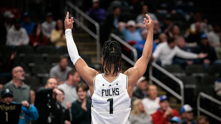 Mar 11, 2026; Kansas City, MO, USA; UCF Knights guard Themus Fulks (1) reacts to game play during overtime against the Cincinnati Bearcats at T-Mobile Center. Mandatory Credit: William Purnell-Imagn Images
