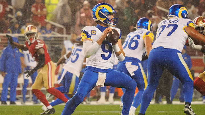 Dec 12, 2024; Santa Clara, California, USA; Los Angeles Rams quarterback Matthew Stafford (9) looks to pass the ball against the San Francisco 49ers during the second quarter at Levi's Stadium. Mandatory Credit: Kelley L Cox-Imagn Images