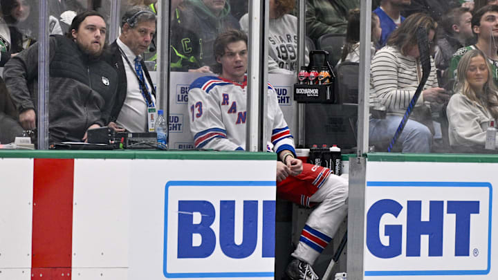 Dec 20, 2024; Dallas, Texas, USA; New York Rangers center Matt Rempe (73) sits in the penalty box after receiving a penalty for an elbow on Dallas Stars defenseman Miro Heiskanen (not pictured) during the third period at the American Airlines Center. Mandatory Credit: Jerome Miron-Imagn Images