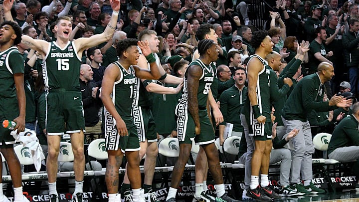 Jan 9, 2025; East Lansing, Michigan, USA;  The Michigan State Spartans bench reacts after Nick Sanders scores late in the game against the Washington Huskies at Jack Breslin Student Events Center. Mandatory Credit: Dale Young-Imagn Images